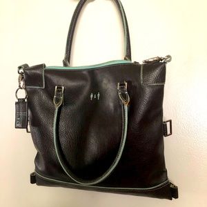Be proud to carry this lovely, preowned, brown leather ViaVegan purse.
